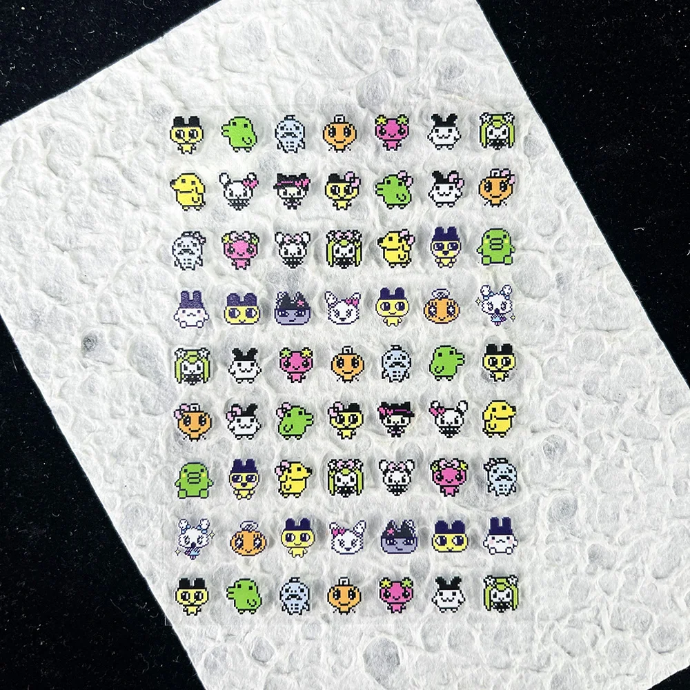 かわいいゲーム進化電子ペットステッカーネイルアートかわいい動 - Nail Tech Accessories のレビューと価格